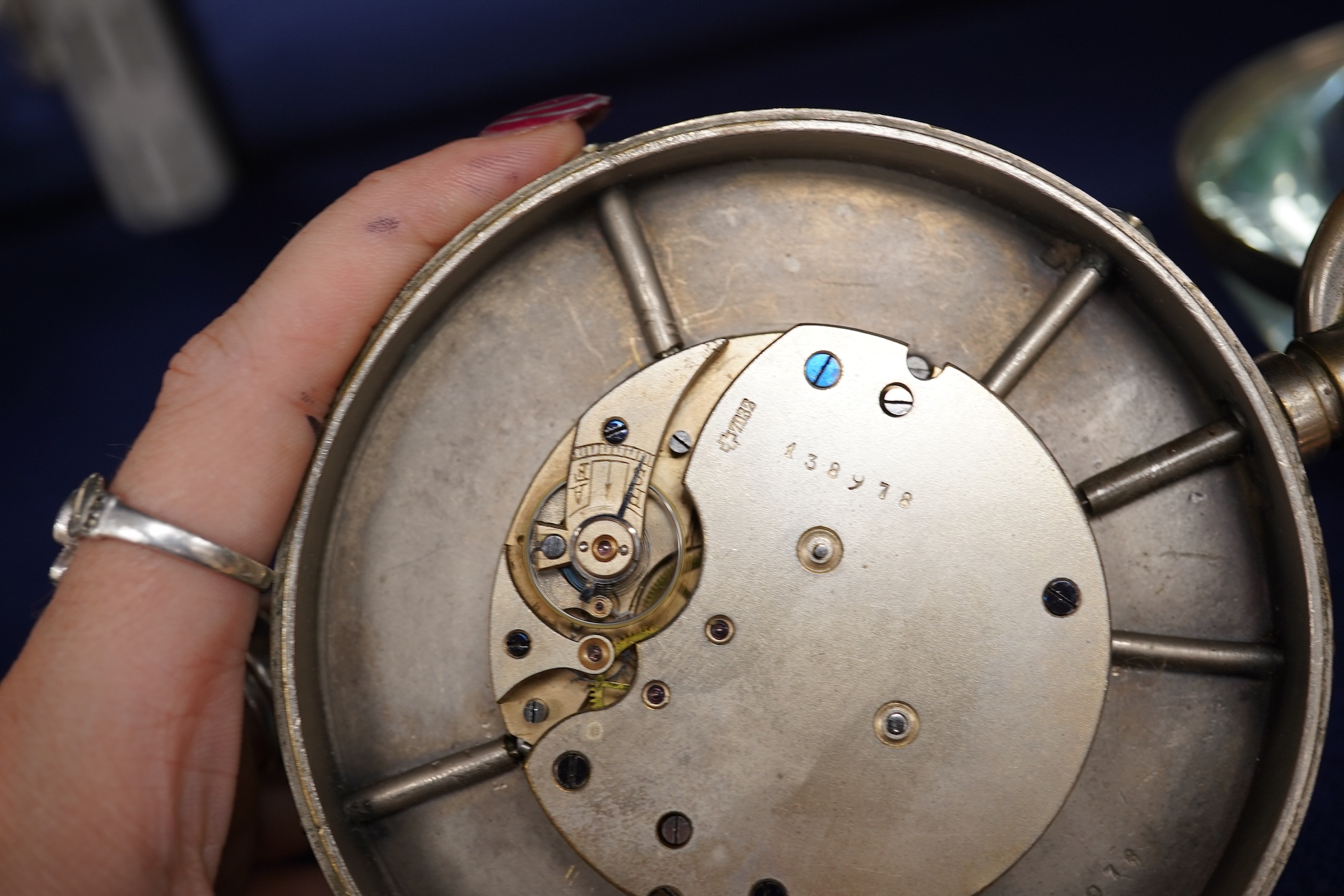 A large oversized spherical glass encased desk timepiece, with four subsidiary dials, 16cm